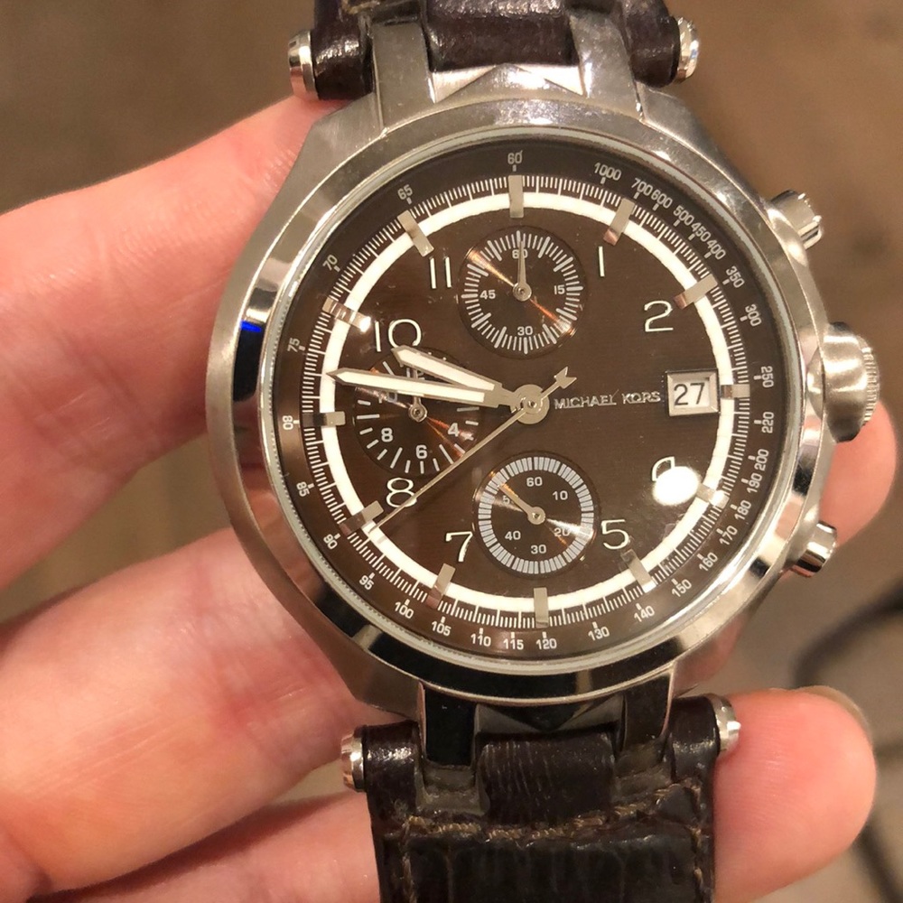 Women’s embossed brown leather Michael Kors watch.